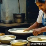 제과제빵 현장 경험이 필요한 이유 - A detailed scene inside a traditional Bengali bakery kitchen, showing a skilled Bengali baker carefu...